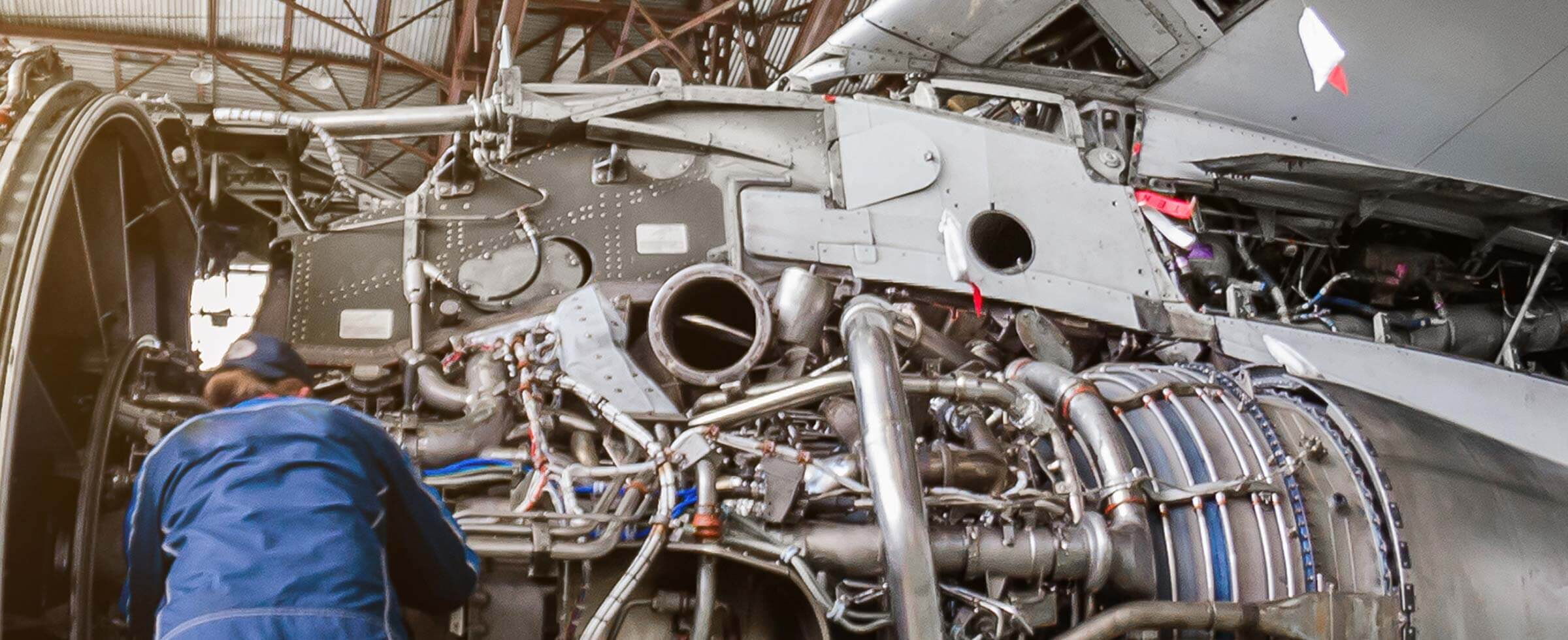 Woman working on a jet engine